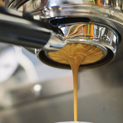 Pulling coffee through the espresso machine